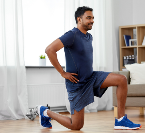 Man doing home workout exercise virtual program