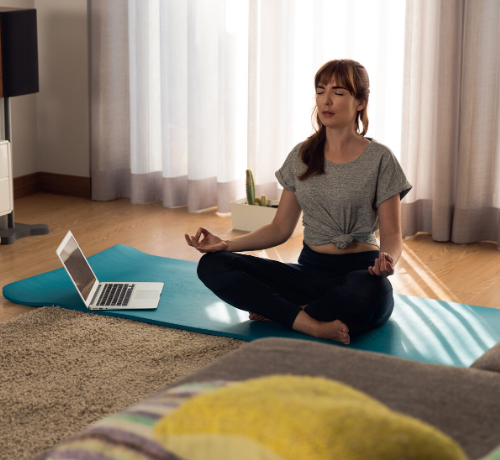 Woman doing yoga home workout program